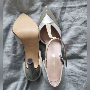 Closed toe high heelshoes.  Size 38.  Colors are blue, grey, silver